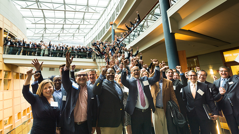 All of McDonough Executive Challenge participants and the Dean celebrate on the stairs of the Hariri building 