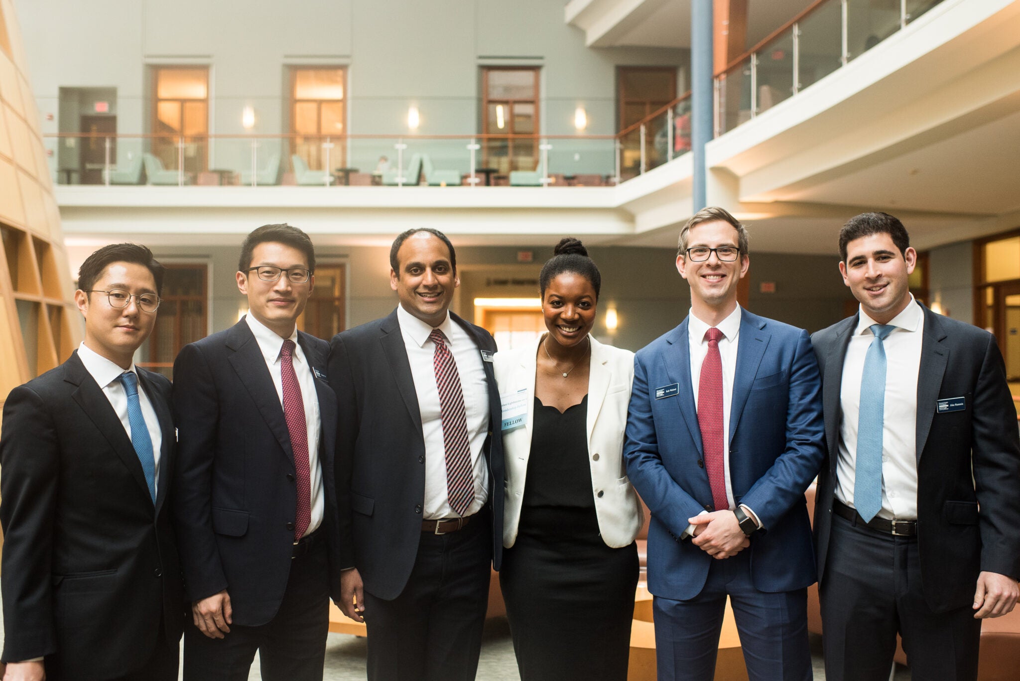 MBA students standing in Rafik B Hariri Building atrium