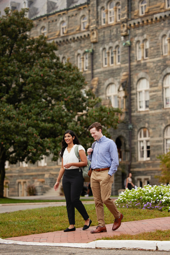 MiM students walking by Healy Hall