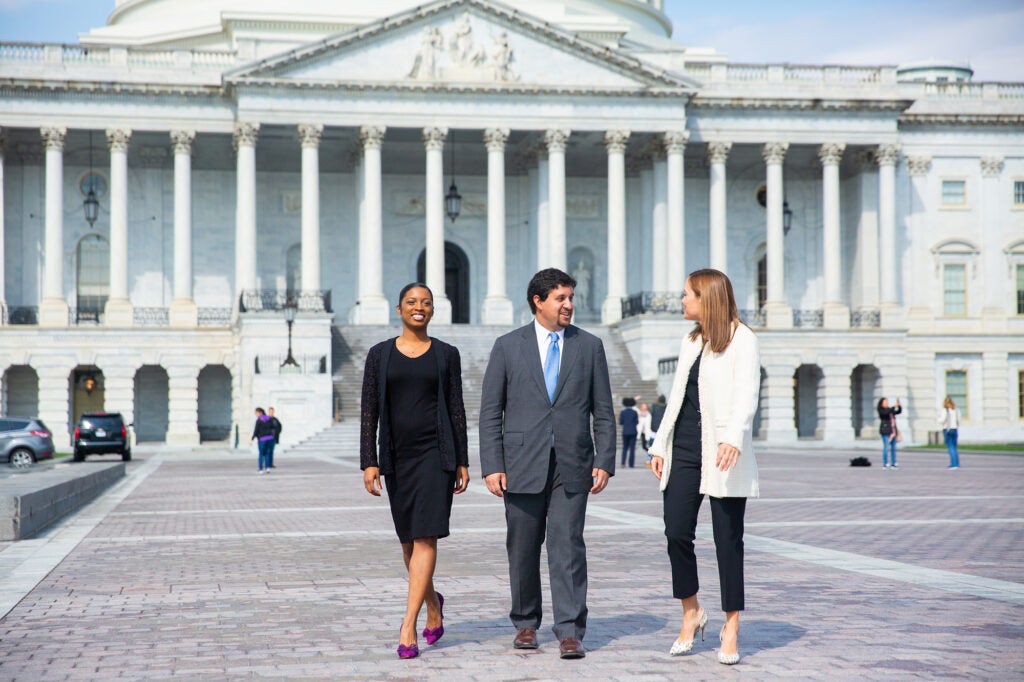 3 IBP students in front of capitol hill