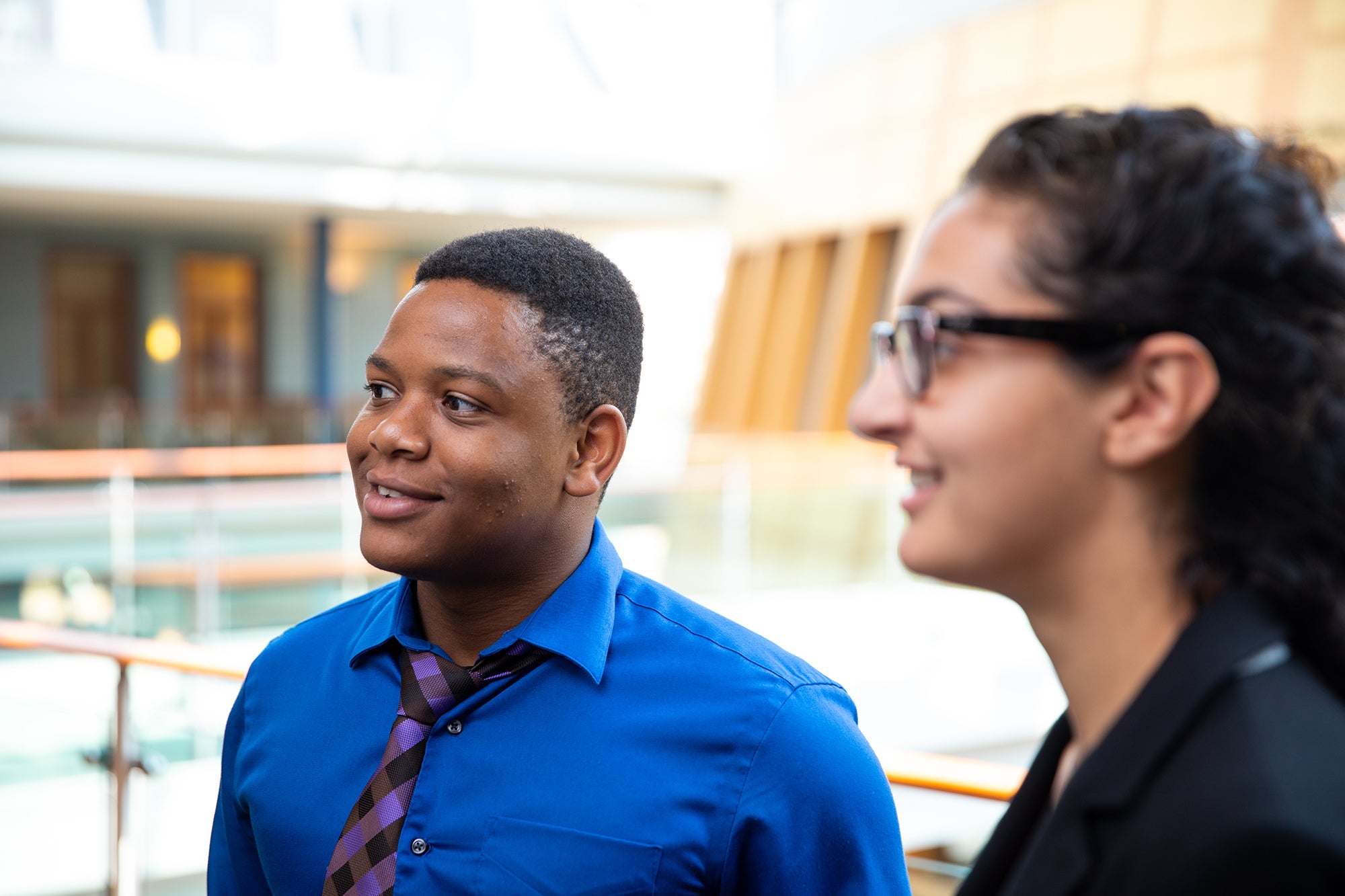 MiM Students talking inside Hariri Atrium