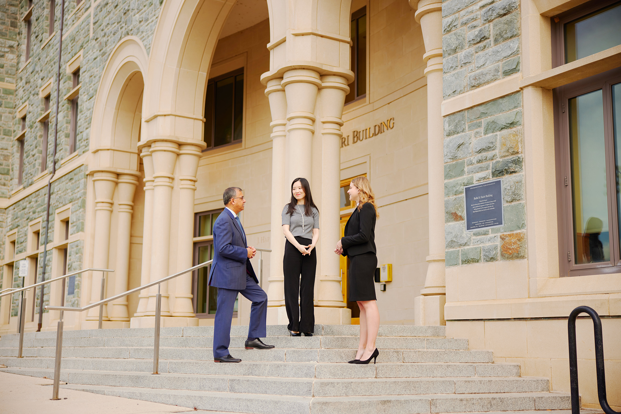 MBA students and Dean Prashant on the front steps of Hariri