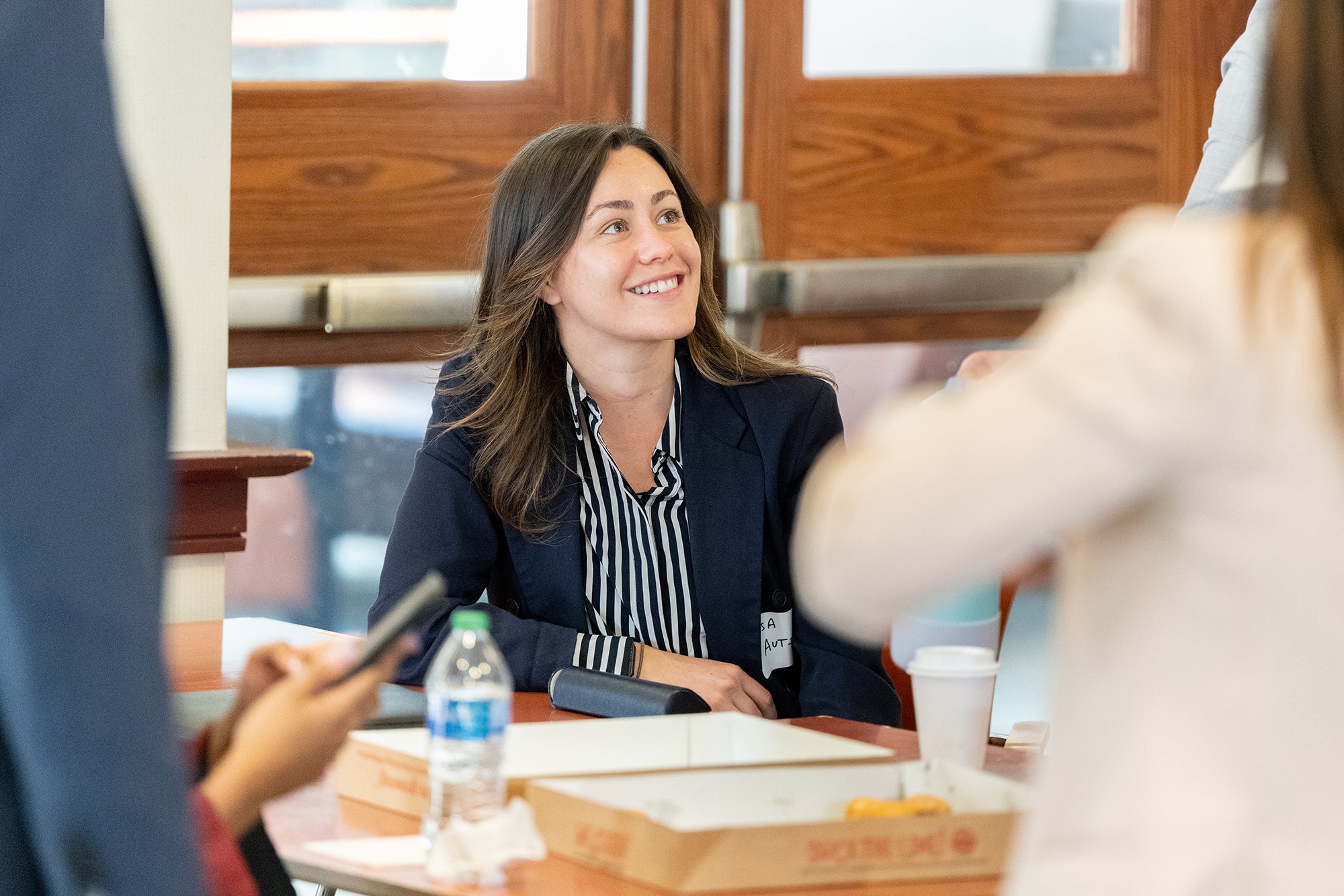 mba student sitting during lunch smiling