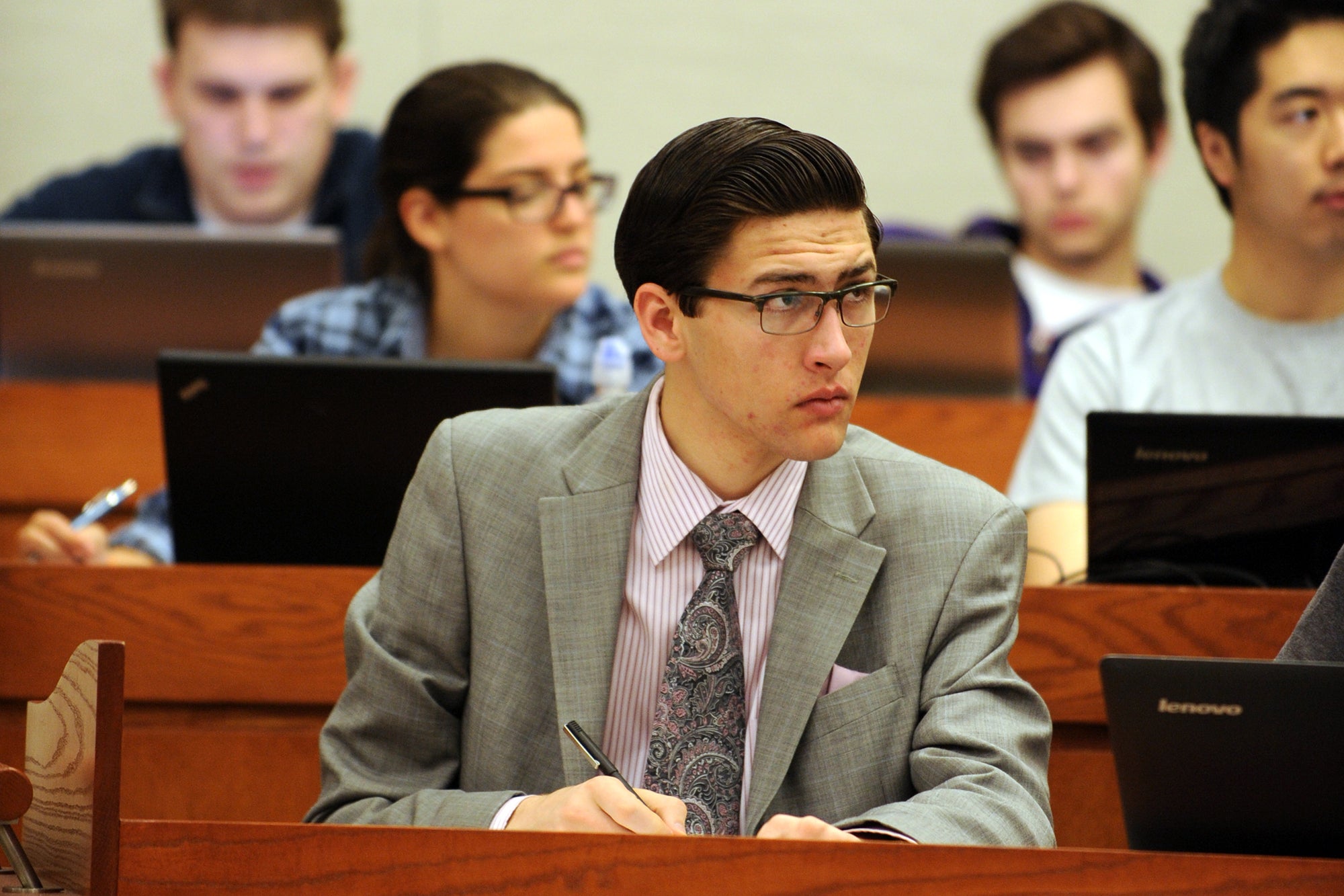 Undergraduate Student taking notes in class