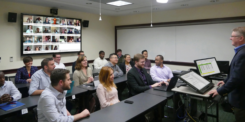 The Georgetown MSF Blended classroom in action. Students are in person and on screen
