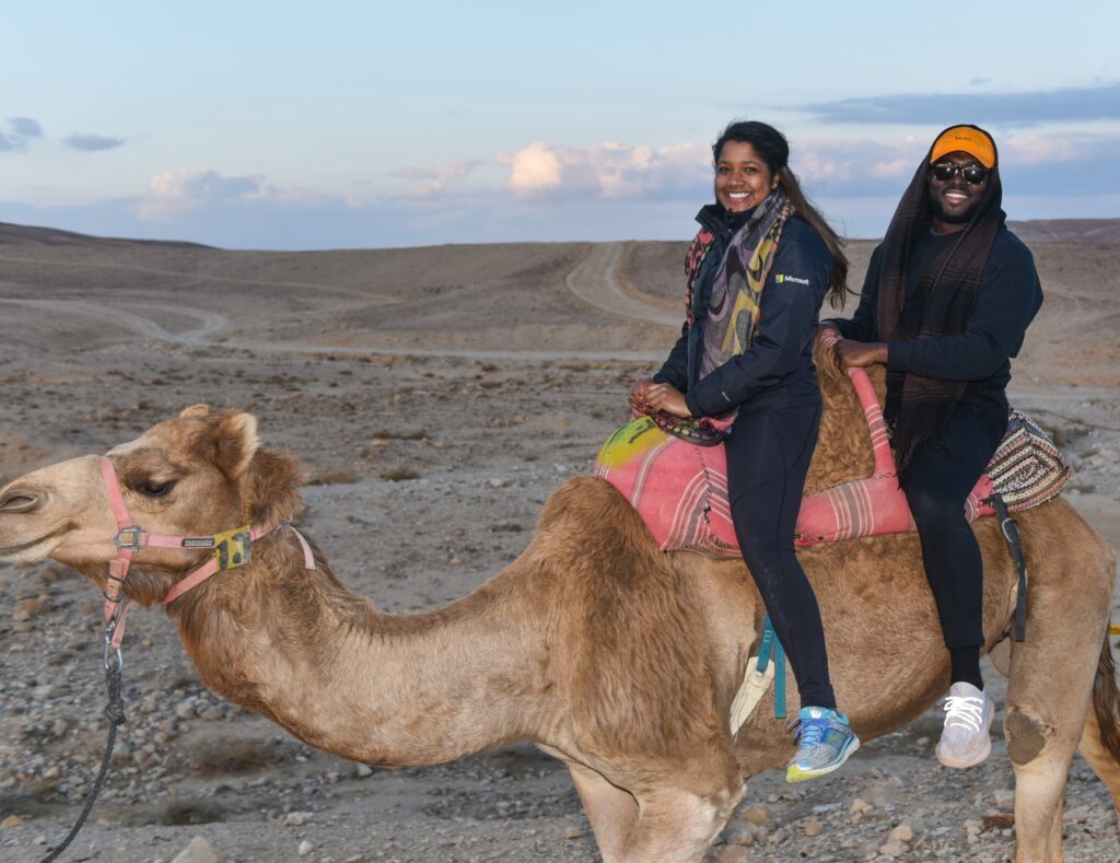 two mba students on camel