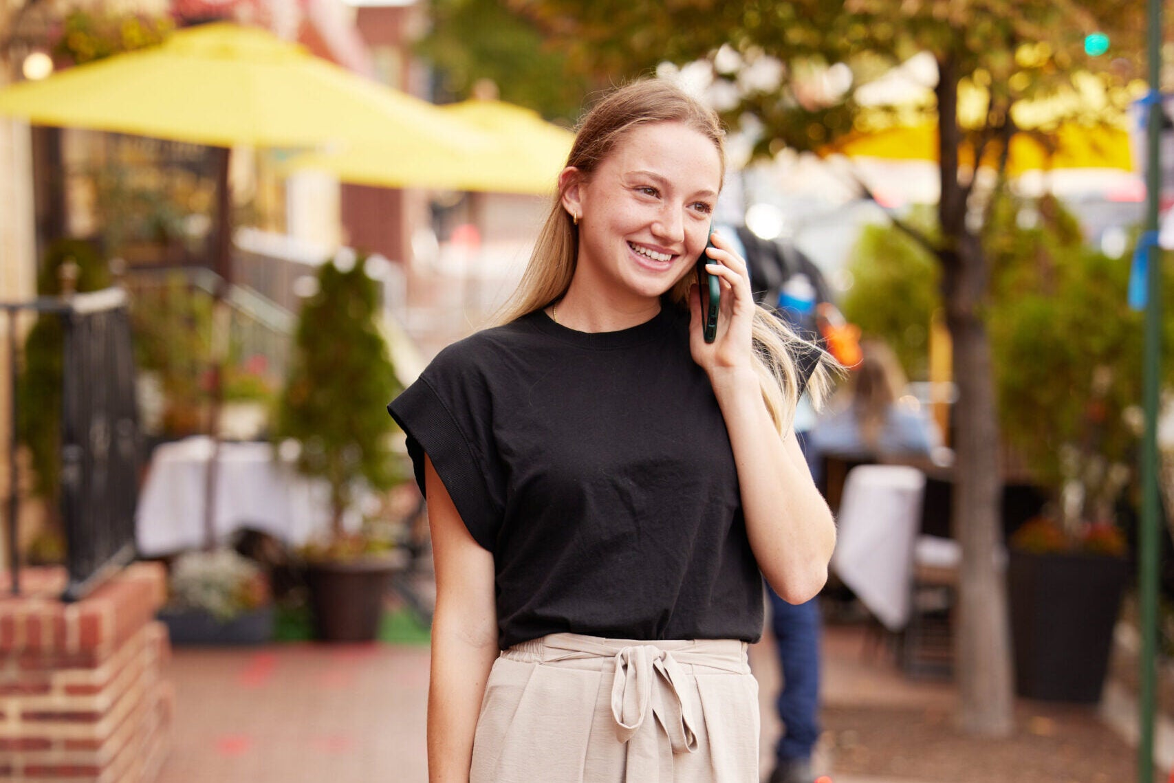 MiM student talking on phone walking around Georgetown