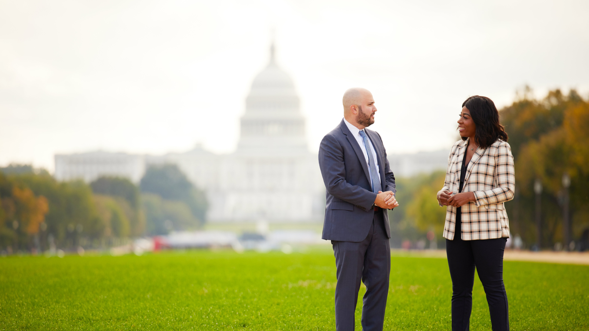 Two MBA students talking in front of the National Mall in Washington, D.C.