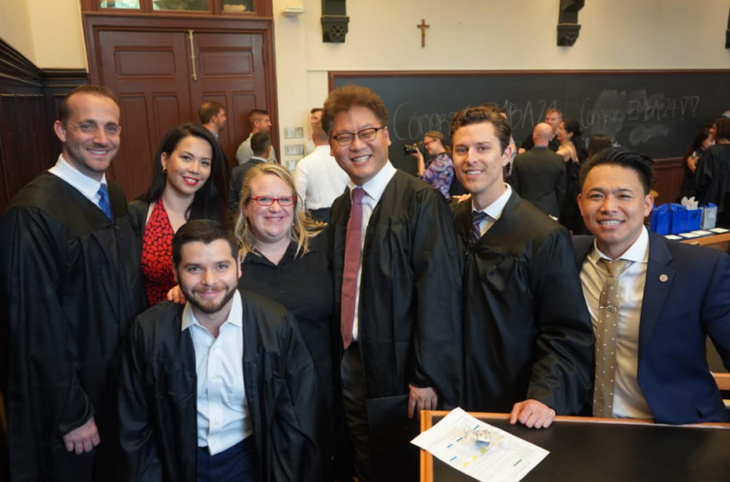 Jason Dodier (EMBA'19) with fellow classmates at commencement