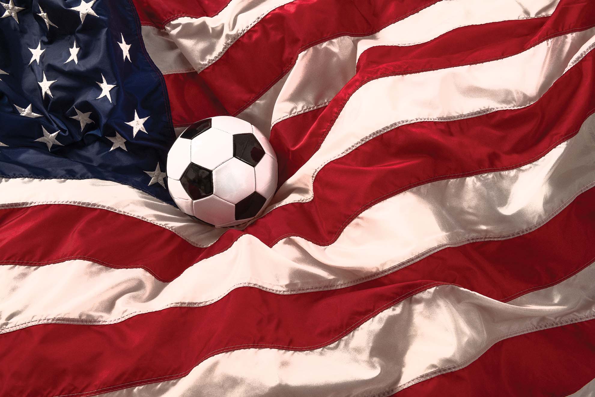 Soccer ball resting in American flag