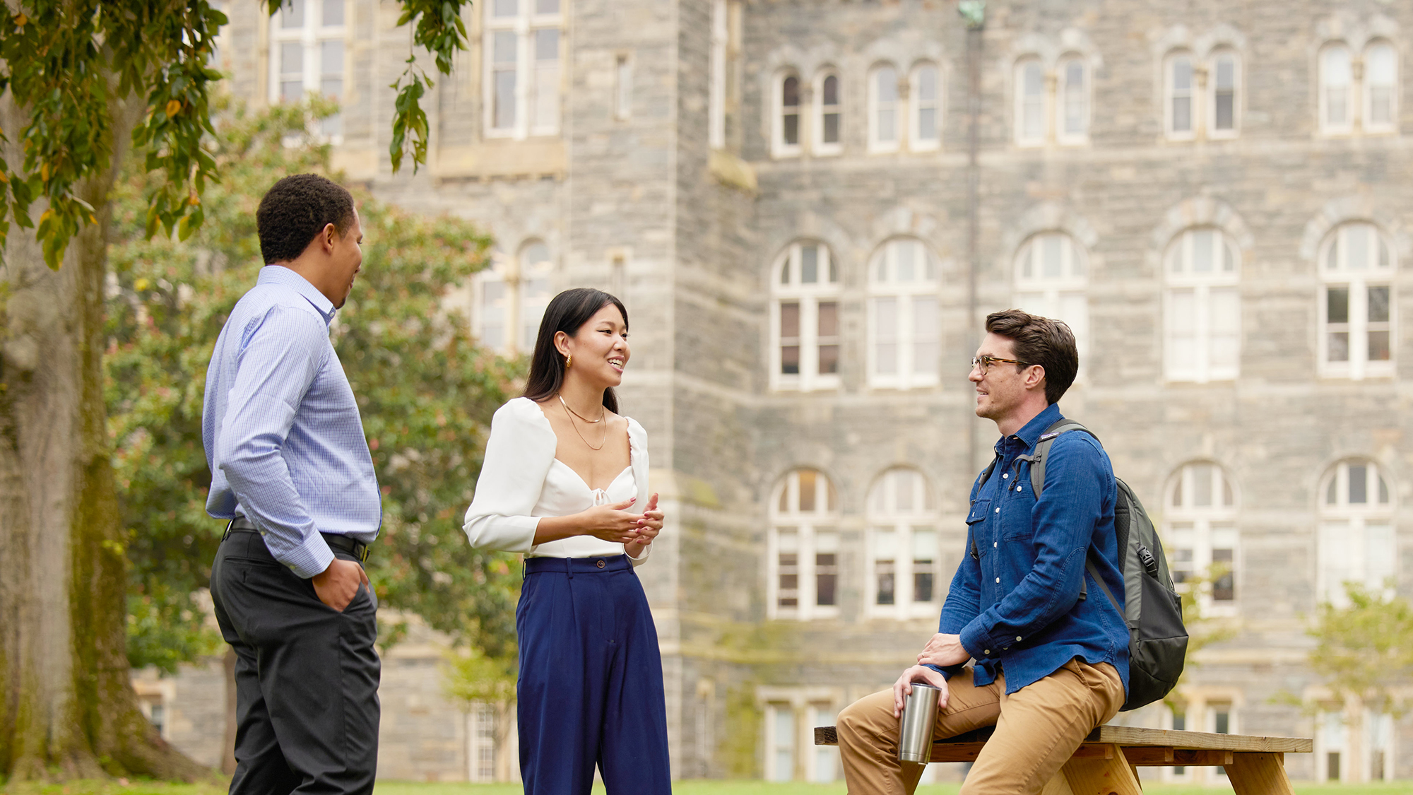 Part time MBA students chatting on Healy lawn on Georgetown University's Campus