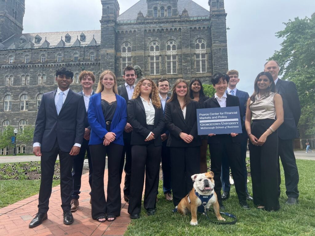 FinPolicy Scholars pose with Jack the Bulldog