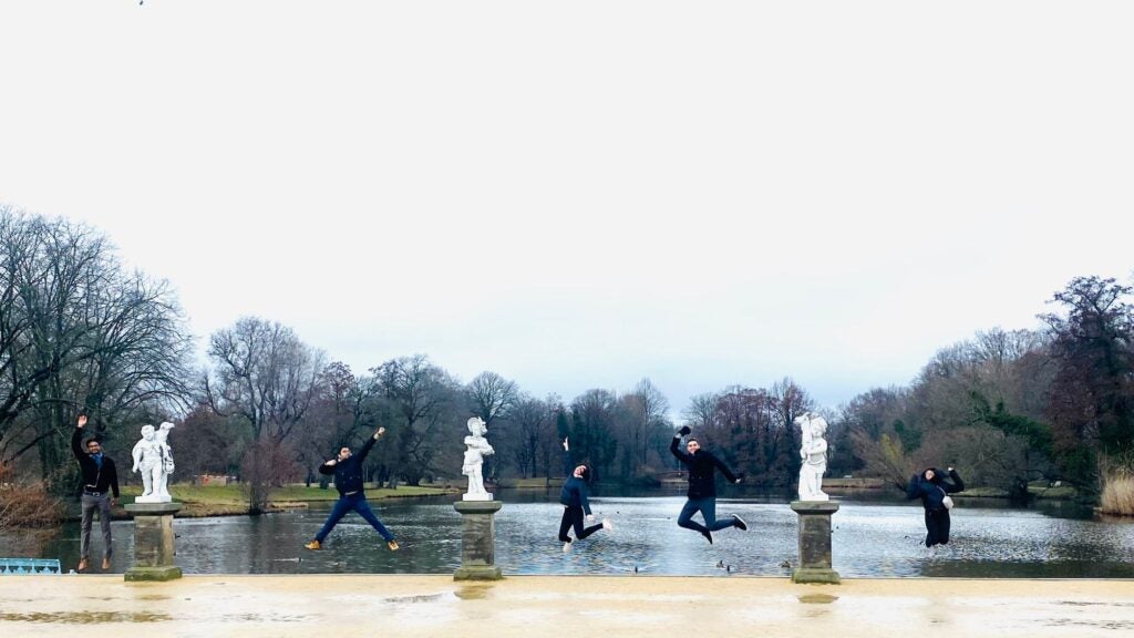 group of MBA students jumping in the air in Berlin