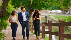 students stroll discussing class topics