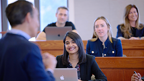 students learning in a classroom in the MBA program