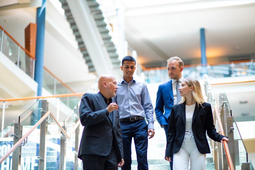 students and professors in the hariri building