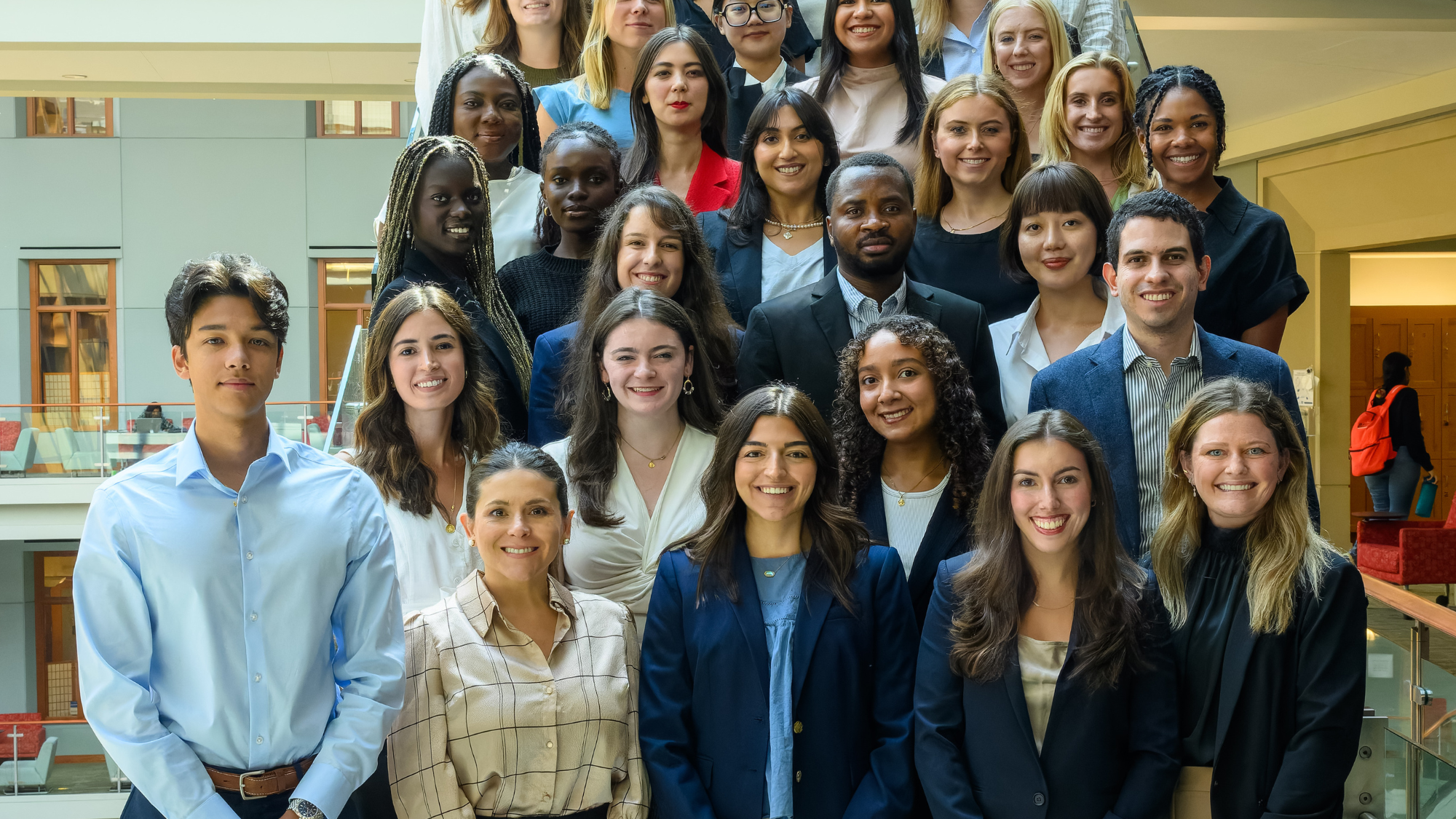 Members of the MS-ESM Class of 2025 gathered on the steps in the Hariri building.