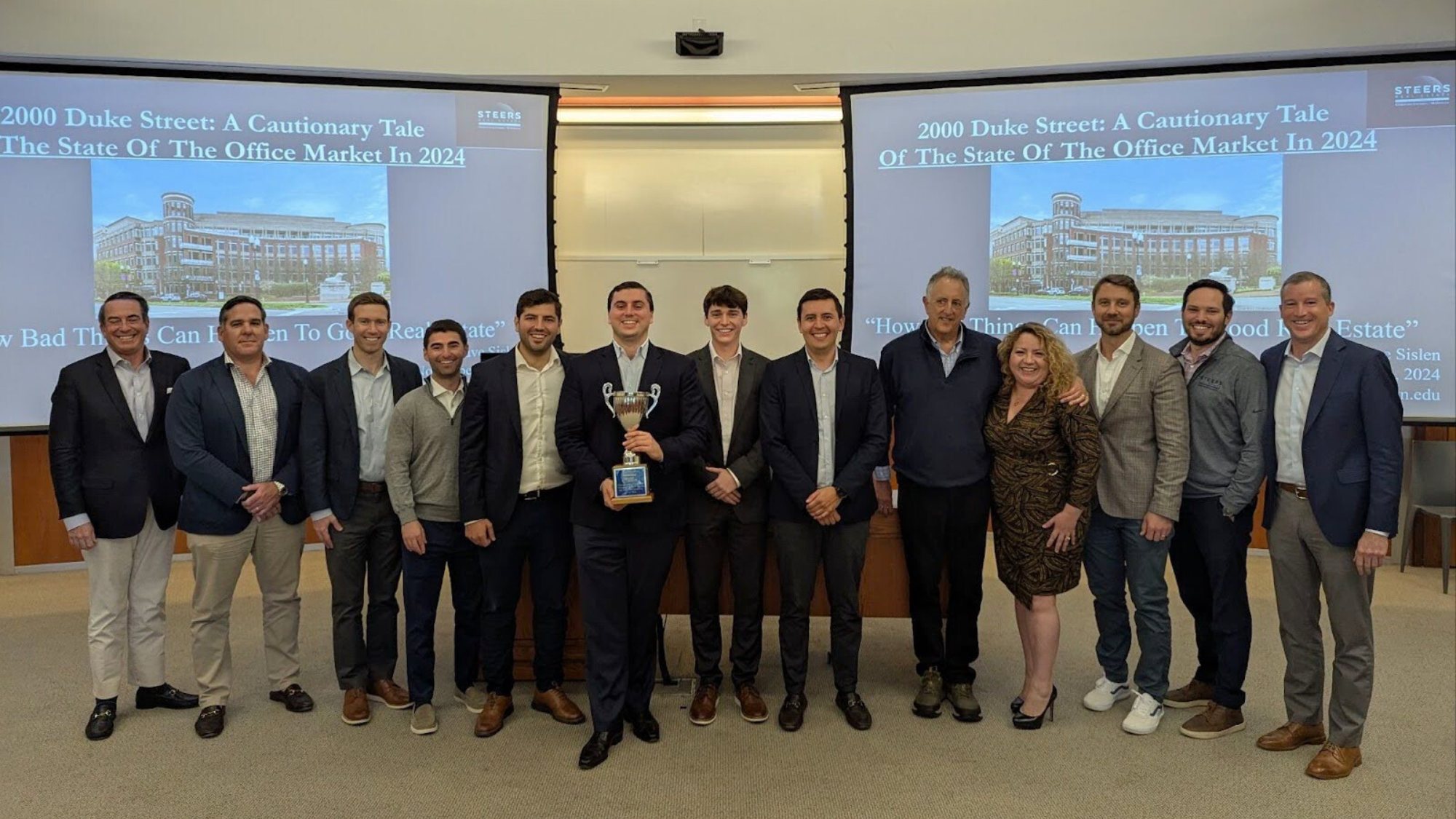 Steers Center students posed with judges during the McDonough Real Estate Case Competition (M-RECC)