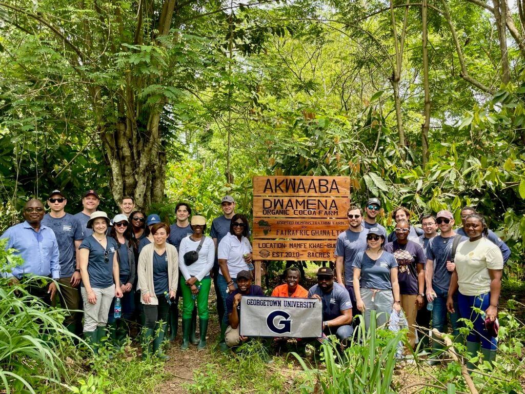 Georgetown students deep in the woods, doing good and representing themselves proudly.