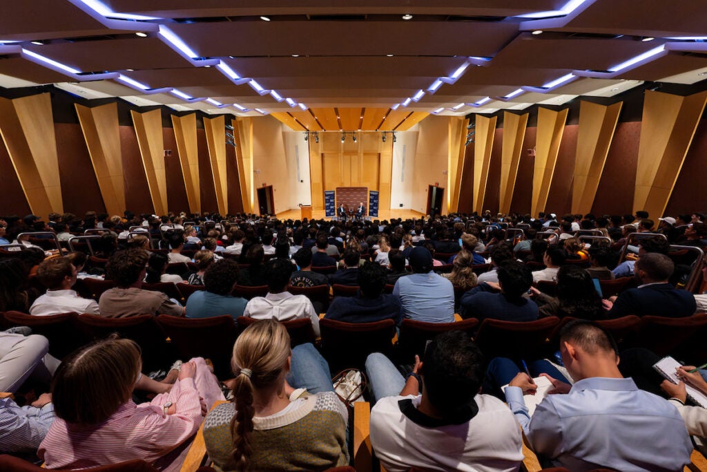 Students inside Lohrfink Auditorium with Jamie Dimon
