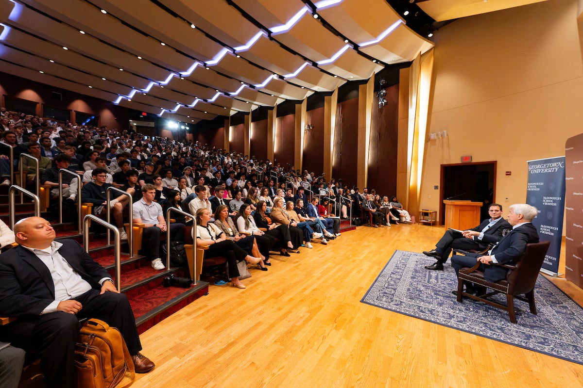 Georgetown McDonough students sit in Lohrfink Auditorium at event with Jamie Dimon