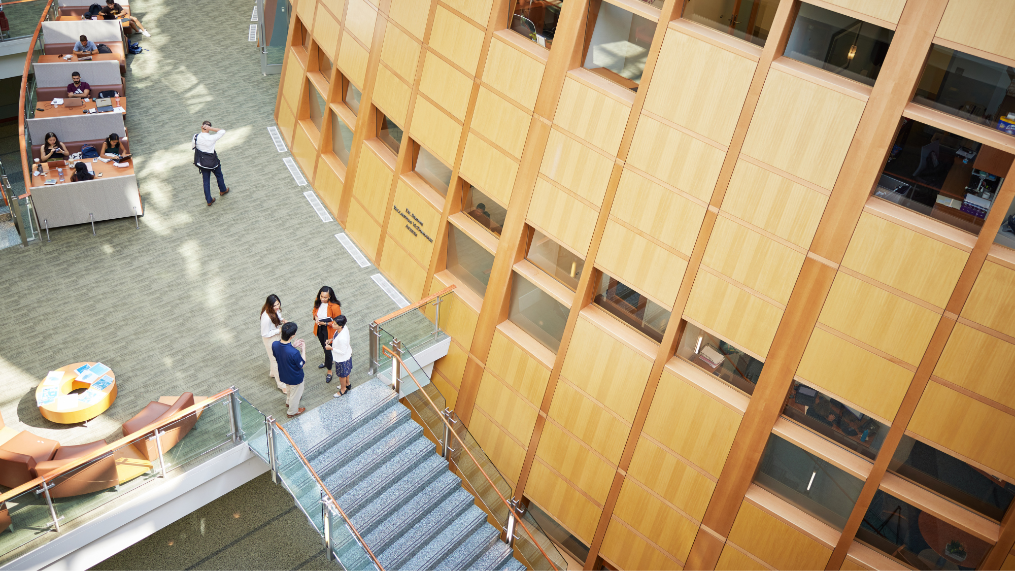 Georgetown MSBA students talking in the atrium of the Hariri Building