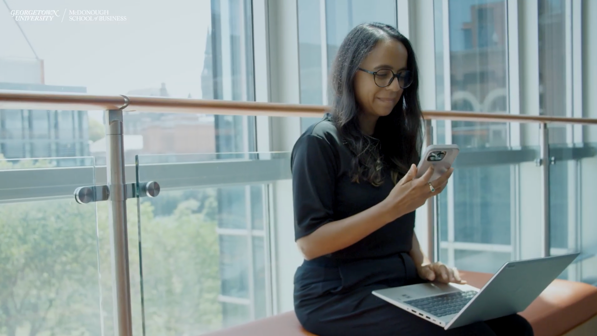 Luisa Chil working on her laptop