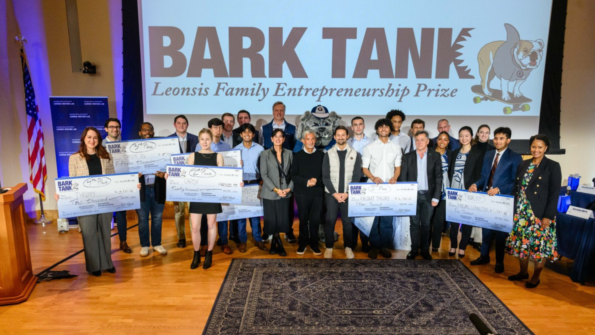 Group photo of fall 2025 Bark Tank finalists with checks at Georgetown McDonough