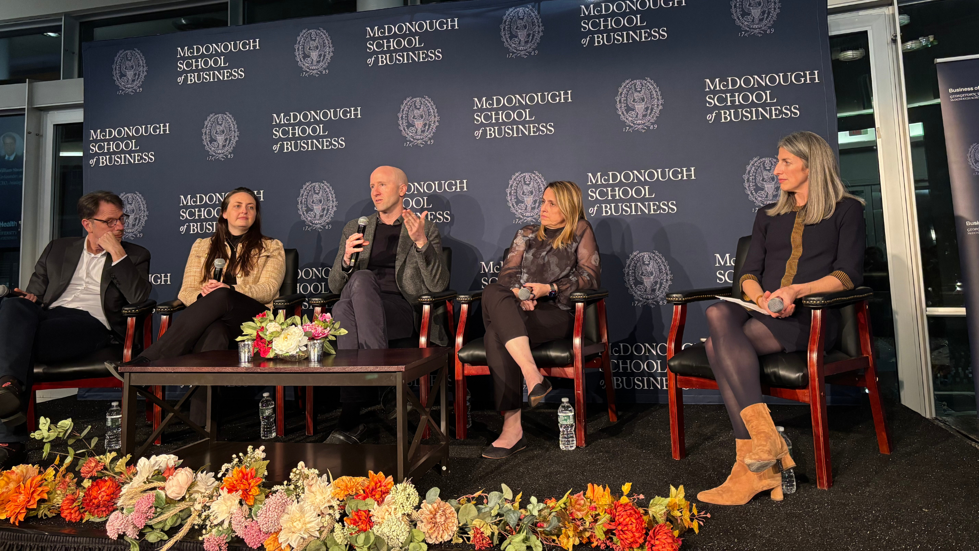 Panel of five experts at Business of Health Initiative event in Fisher Colloquium at Georgetown McDonough