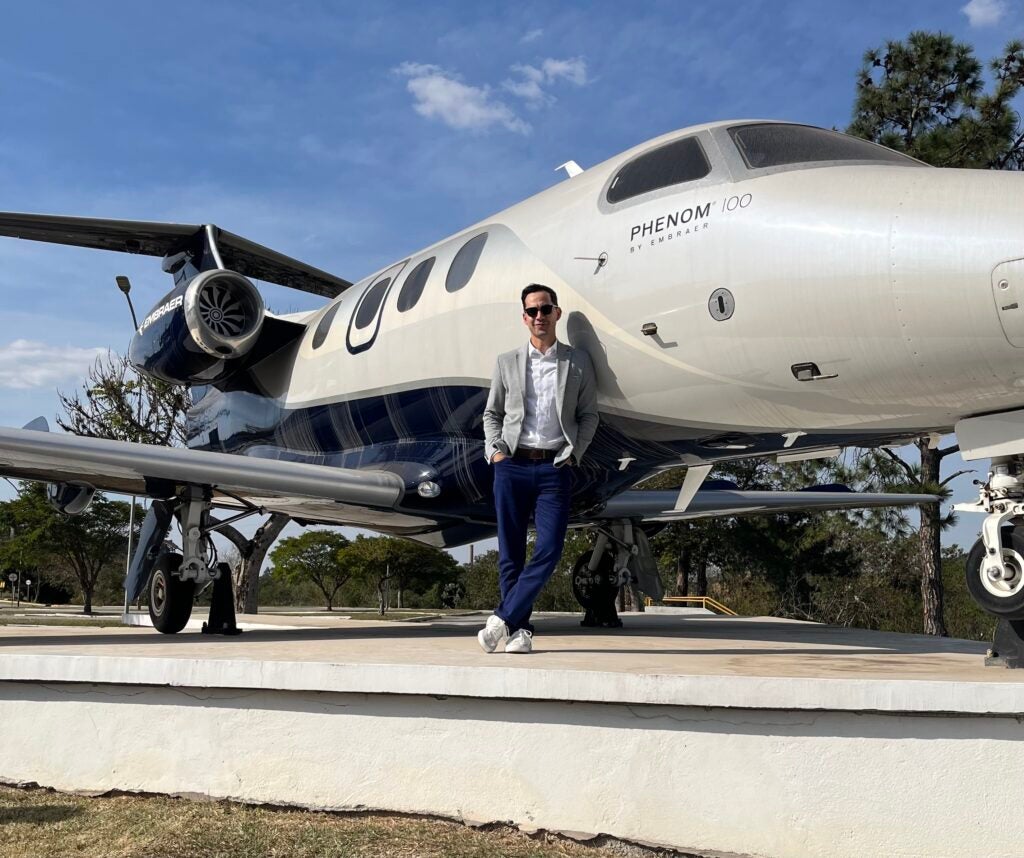 Eddie Silva with an airplane during his GBE trip to Brazil