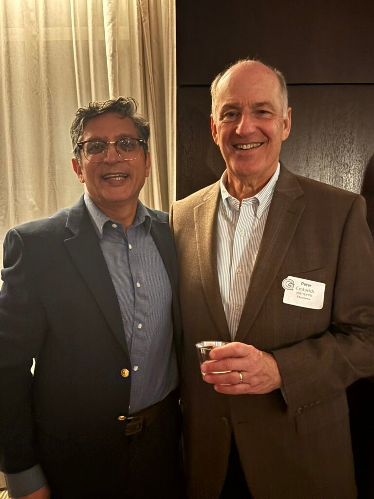 Dahiya (left) with Peter Crnkovich (B’78; right)