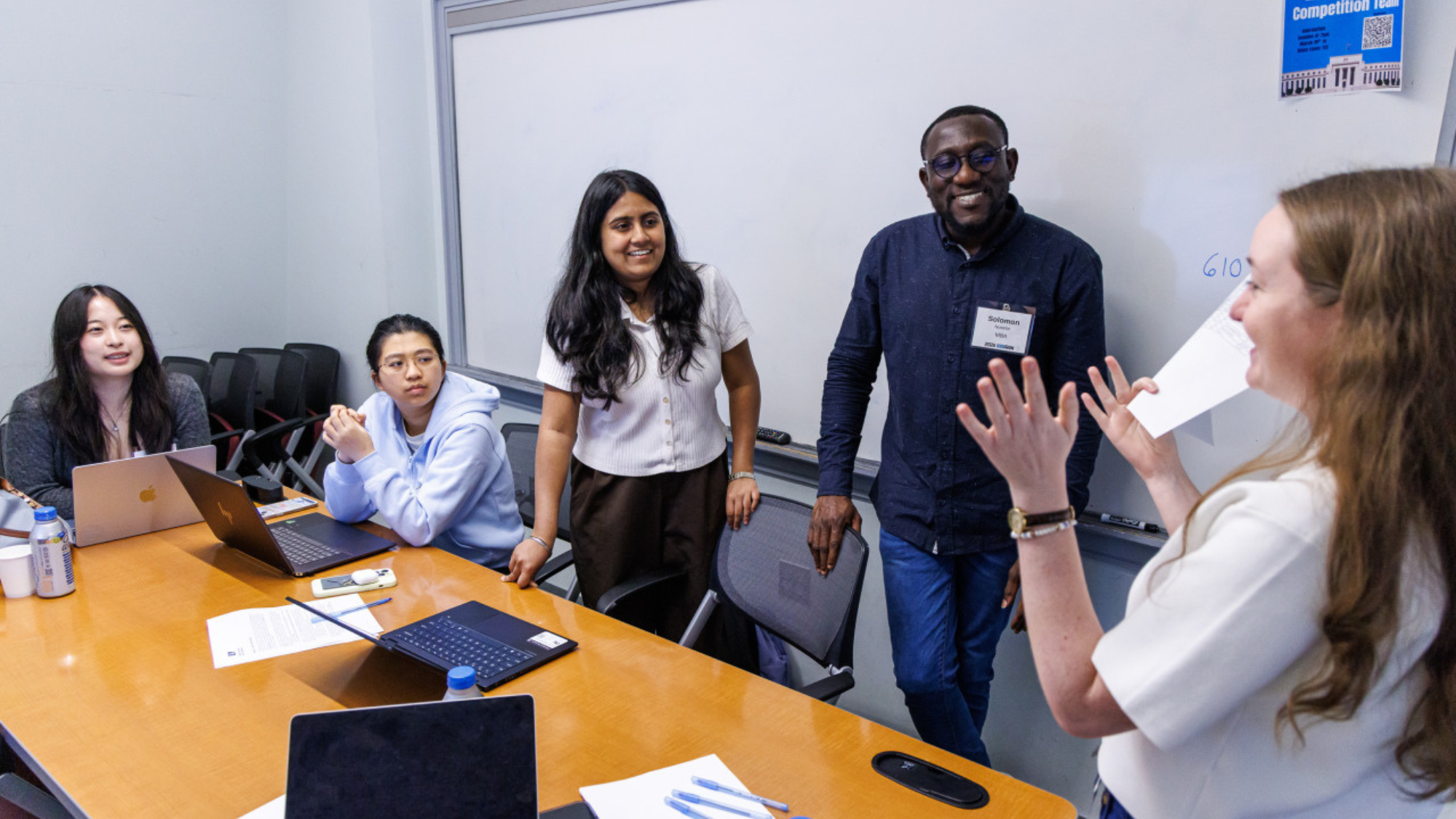 Five Georgetown University students discuss ideas during Datathon 2026