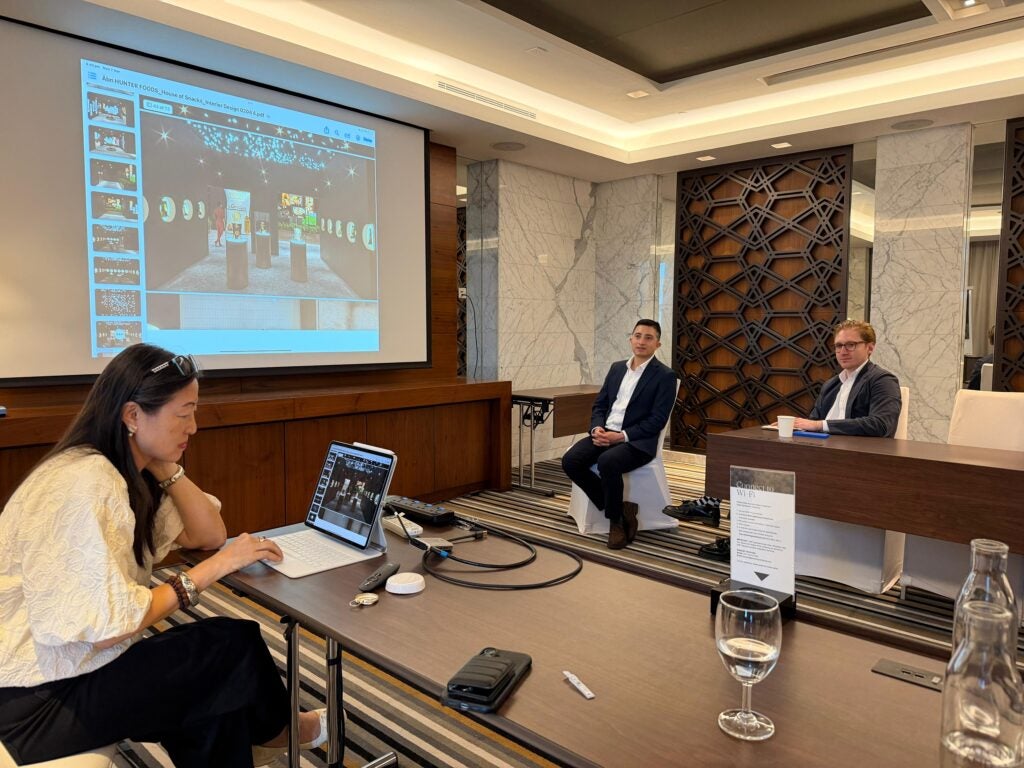 Enrique Pinon and his classmates present their Global Business Experience consulting projects at a hotel in Dubai during the crisis.