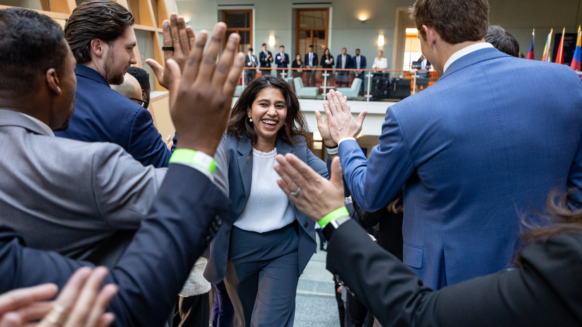 First-year MBA student running up the stairs for the spring 2026 MBA Executive Challenge