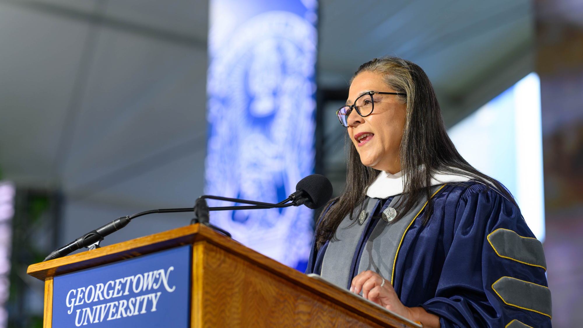 Essya Hanachi addresses graduate business students at Georgetown University
