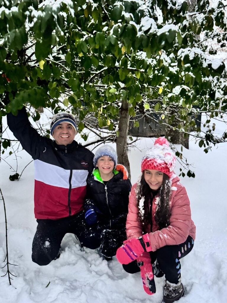 Javier Bustamante enjoying quality time in the winter season with his kids