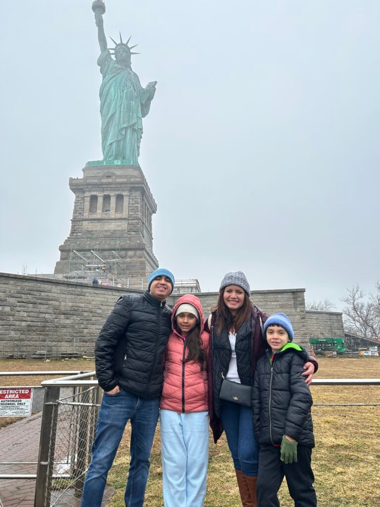 Bustamante with his wife and two children in New York City, New York.