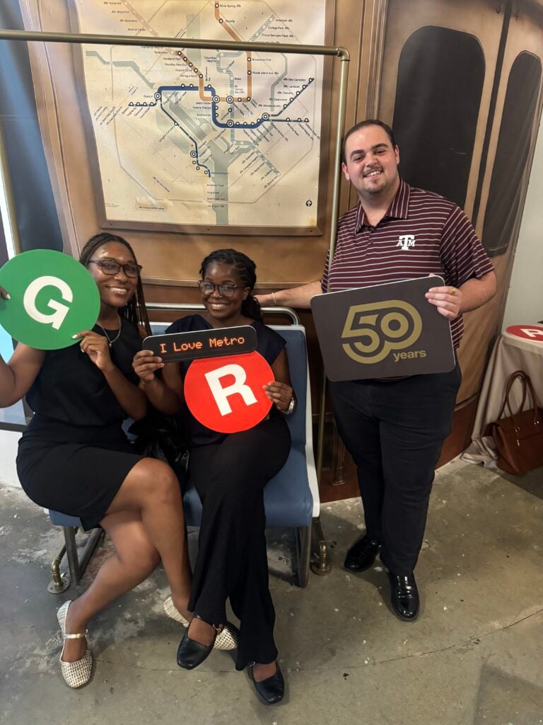 Tia Walker Celebrating DC Metro’s 50th anniversary with fellow interns at the WMATA anniversary popup event.