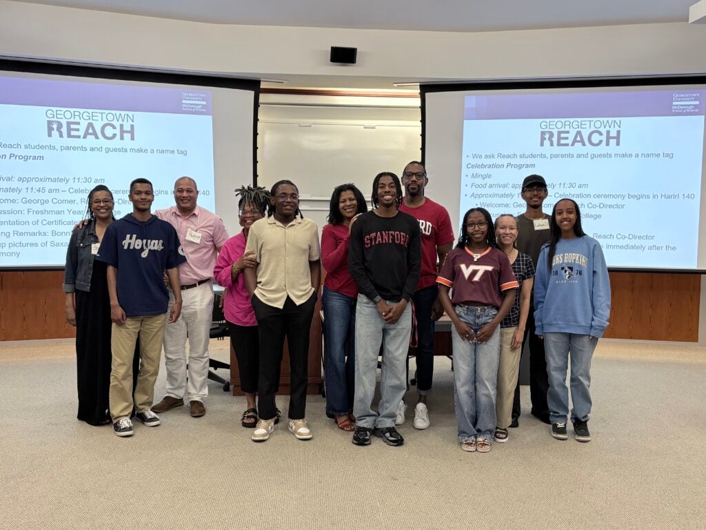 Georgetown Reach students standing together smiling.