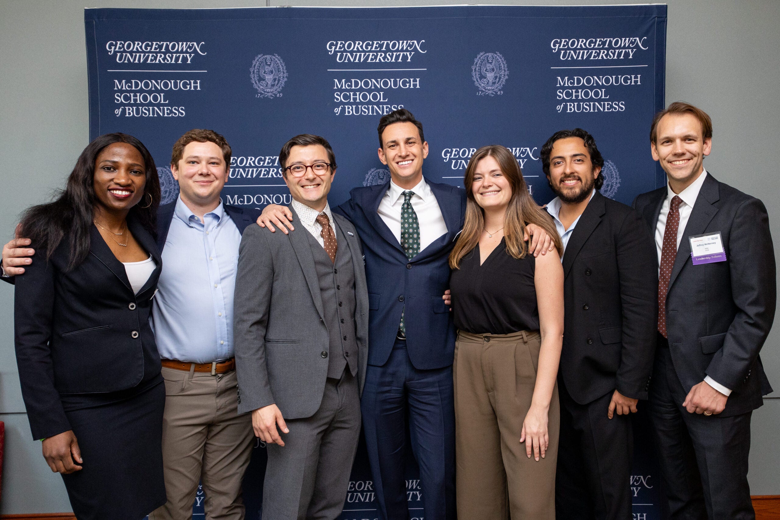 Georgetown MSB students smiling while standing side by side.