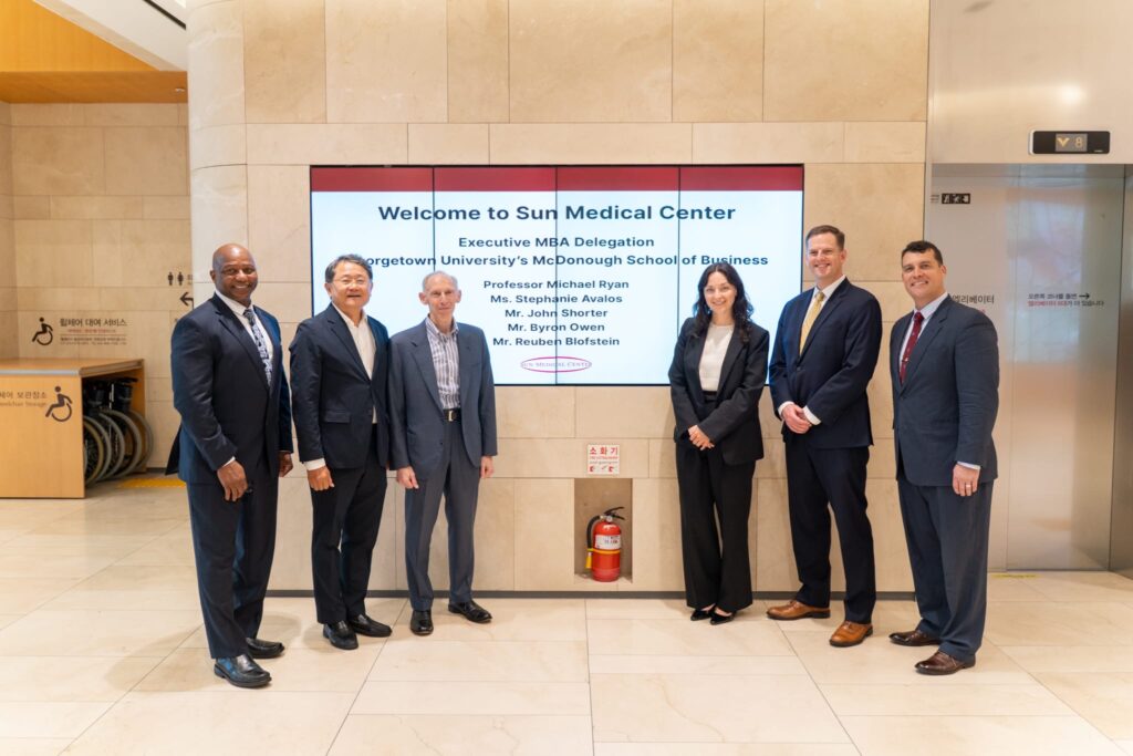 John Shorter and his Executive MBA team preparing to present their projects to Sun Medical Center in South Korea.