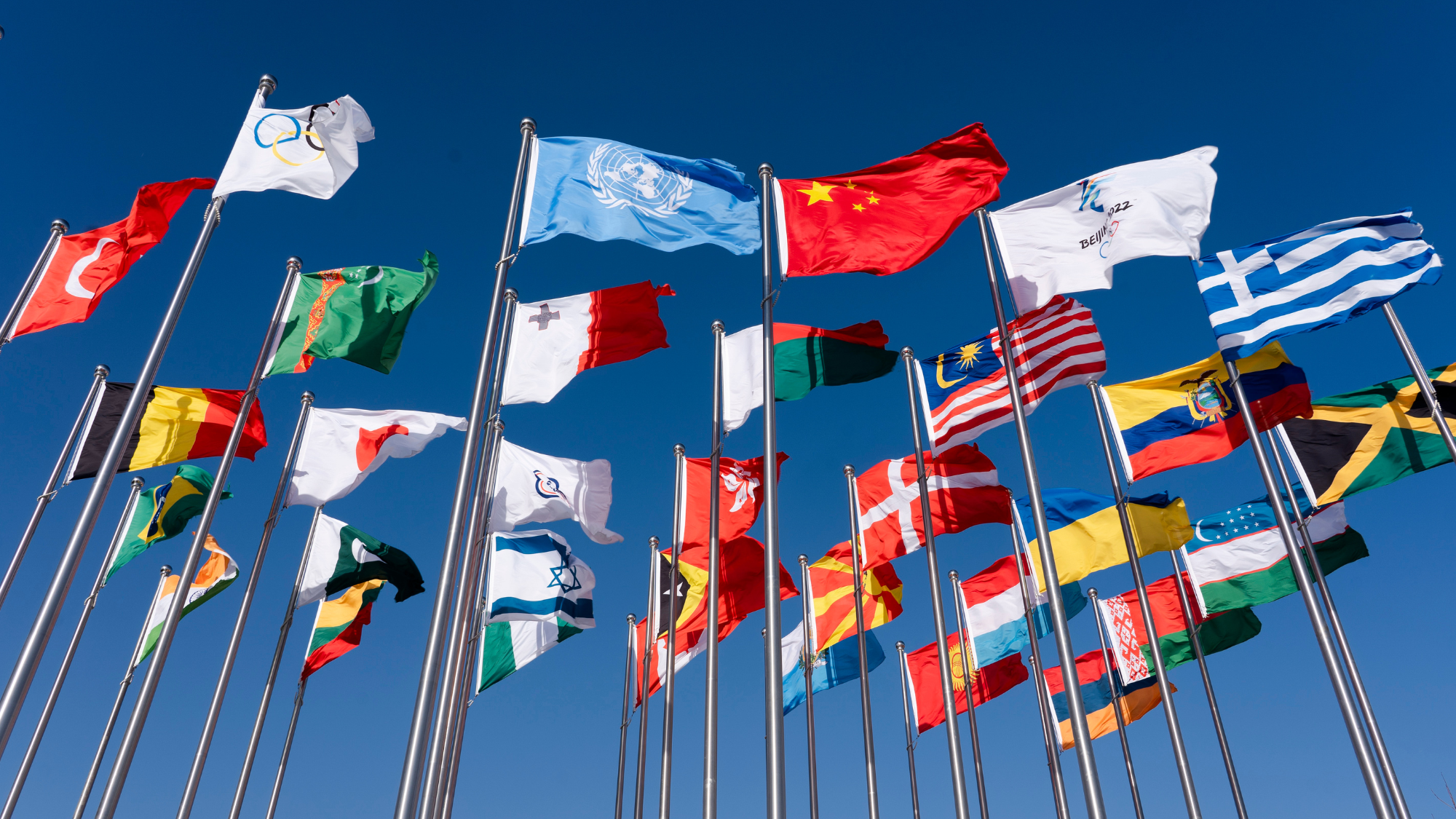World flags set against a blue sky